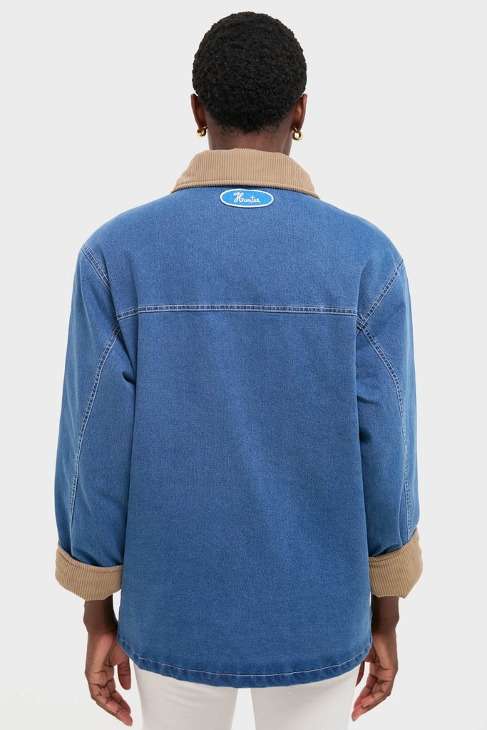 Indigo Barn Jacket with tan-corduroy collar and rolled sleeves, featuring Hunter logo on the back. A classic, effortless, high-end piece for fun, confident style.