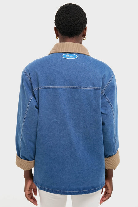 Indigo Barn Jacket with tan-corduroy collar and rolled sleeves, featuring Hunter logo on the back. A classic, effortless, high-end piece for fun, confident style.