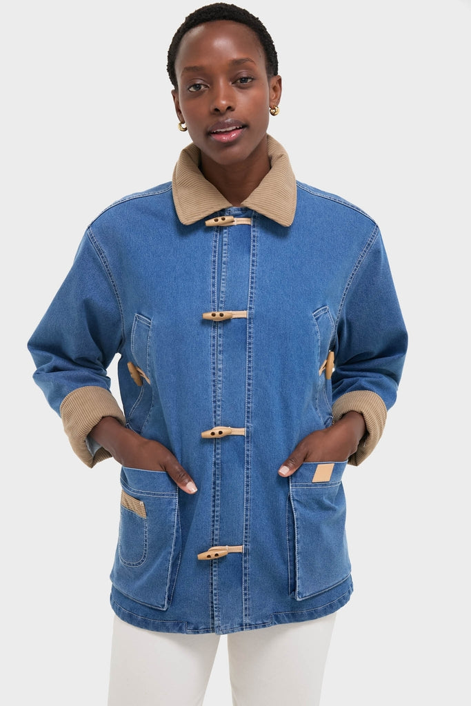 Indigo Barn Jacket with tan corduroy accents and wood-look toggles, exuding classic, effortless style. Perfect for a fun, high-end look.