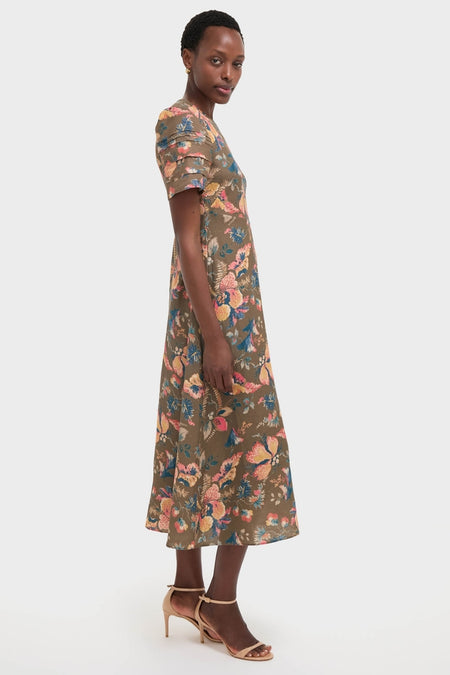 Olive Floral Casey Dress modeled in profile, showcasing its classic botanical print and effortless A-line silhouette for a fun, high-end look.
