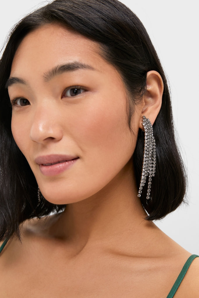 Woman wearing Crystal Rue Earrings, featuring cascading rhinestones, embodying a classic, effortless elegance. Perfect for adding fun, high-end flair to any outfit.