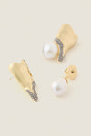 Gold and Pearl Spencer Earrings showcase classic elegance with abstract gold forms, pavé crystals, and baroque pearl drops, embodying effortless, high-end style for fun, special occasions.
