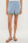 Sky Geometric Embroidered Parish Shorts with scalloped trim and elastic waist, paired with beige sandals for an effortless, high-end, classic summer style.