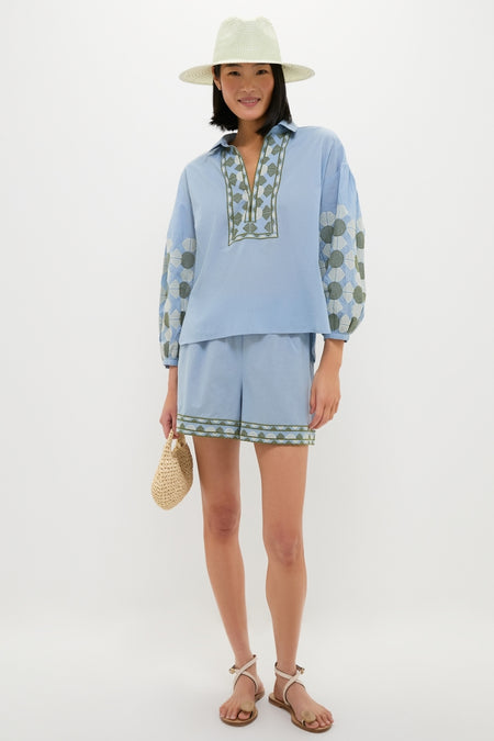 Model in effortless, classic Sky Geometric Embroidered Parish Shorts with matching top, showcasing high-end, fun summer style from Tuckernuck. Perfect for versatile warm-weather destinations.