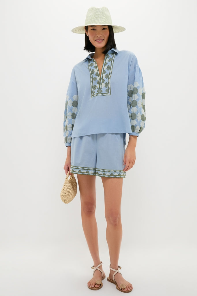 Model in effortless, classic Sky Geometric Embroidered Parish Shorts with matching top, showcasing high-end, fun summer style from Tuckernuck. Perfect for versatile warm-weather destinations.