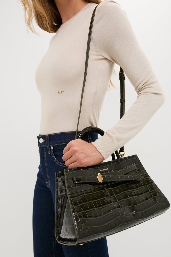 Cypress Croc Embossed Veronica Beard Dash Bag, a classic, high-end handbag with gold-tone hardware, exudes effortless style and fun, complementing any outfit with its structured elegance.