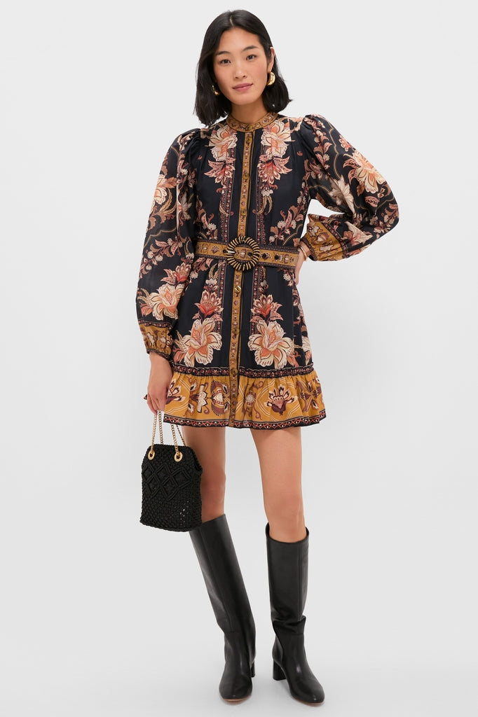 Model showcases a classic, effortless look with a Black Small Macrame Veronica Beard Slouch Bag, paired with a floral dress and high-end accessories for a fun, confident style.