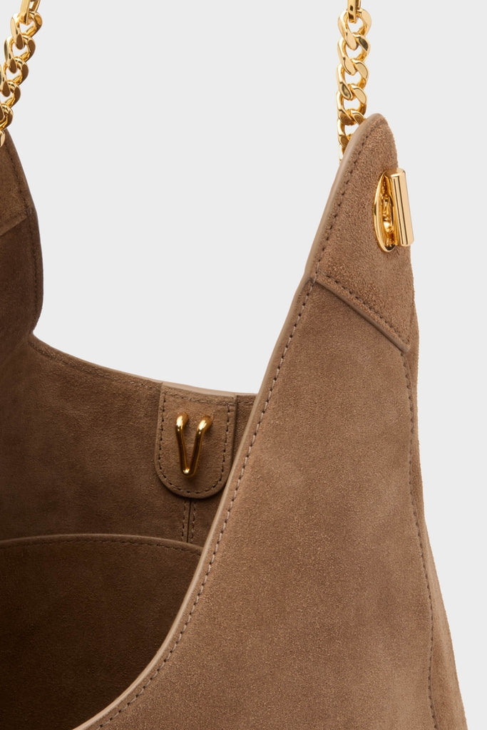 Bark Suede Jour Bag, a classic hobo-style shoulder bag with gold-tone hardware, featuring an effortless chunky chain strap and fun, high-end design elements from Tuckernuck.