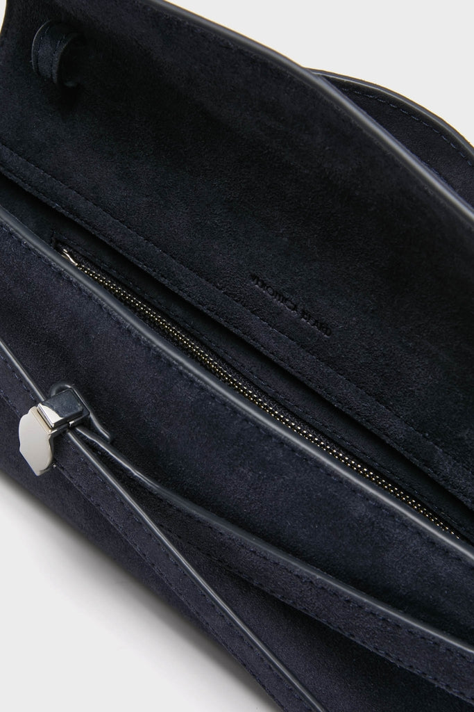 Navy Suede Veronica Beard Dash Clutch featuring an effortlessly classic design with a zippered inner pocket, soft suede lining, and high-end silver-tone hardware.