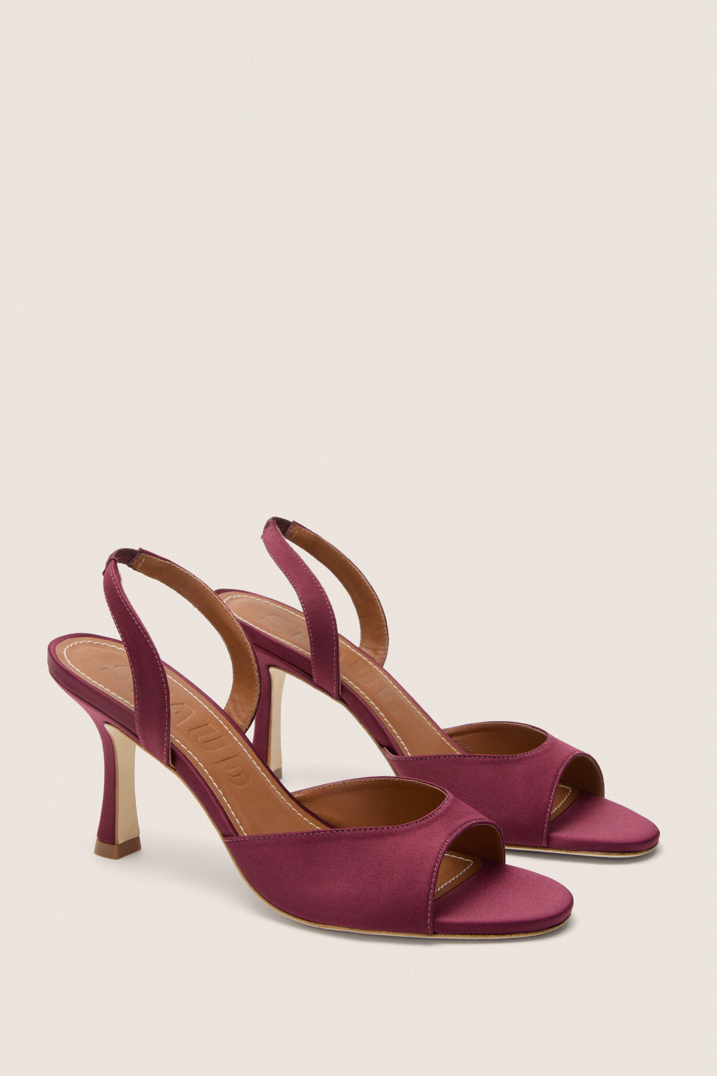 Mulberry Brigitte Heel: Classic open-toe slingback sandals in lustrous satin, featuring effortless style with medium-height heels and elastic straps for a high-end, fun look.