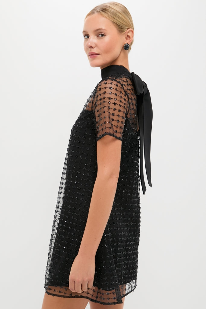 Stardust Onyx Ilana Dress: A classic, high-end mini with a sheer, starry overlay and a self-tie bow. Effortless and fun for a festive night out.