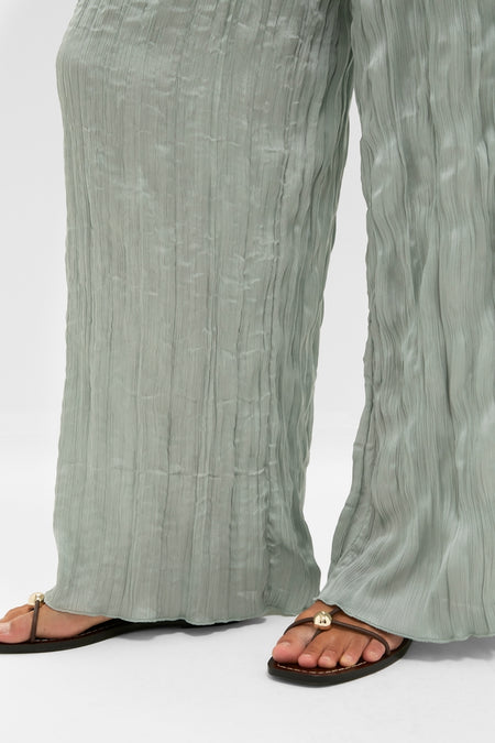 Silver Sage Nami Pant: classic, effortless wide-leg plisse pants with an elastic waistband, styled with flat thong sandals for a fun, high-end look.