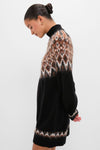 Zermatt Liza Sweater Dress: A classic, high-end black knit dress featuring an effortless Fair Isle yoke and hem, ribbed mock neck, and long sleeves, exuding fun sophistication.
