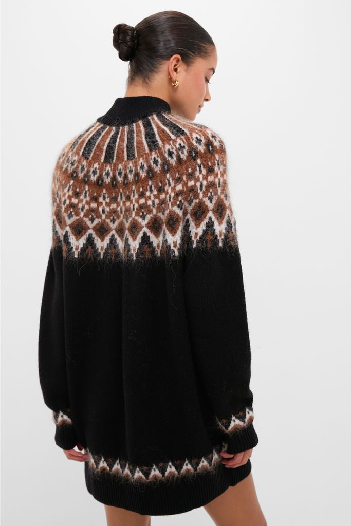 Model in a classic Zermatt Liza Sweater Dress, featuring an effortless fair-isle pattern, exuding a fun, high-end vibe from Tuckernuck's stylish collection.