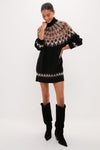 Zermatt Liza Sweater Dress modeled in an effortless, classic style with a Fair Isle yoke, paired with high-end suede boots for a fun, confident look.