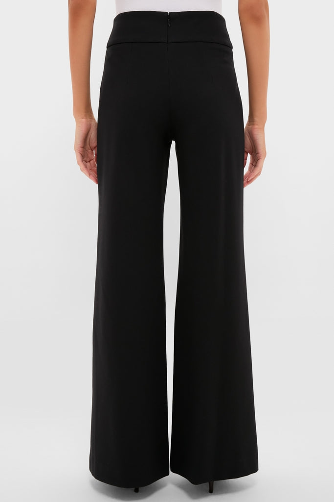 Model in classic, black Kalinda Pant; high-waisted, wide-leg, with a polished pressed crease. Effortless, high-end style perfect for both work and fun outings.