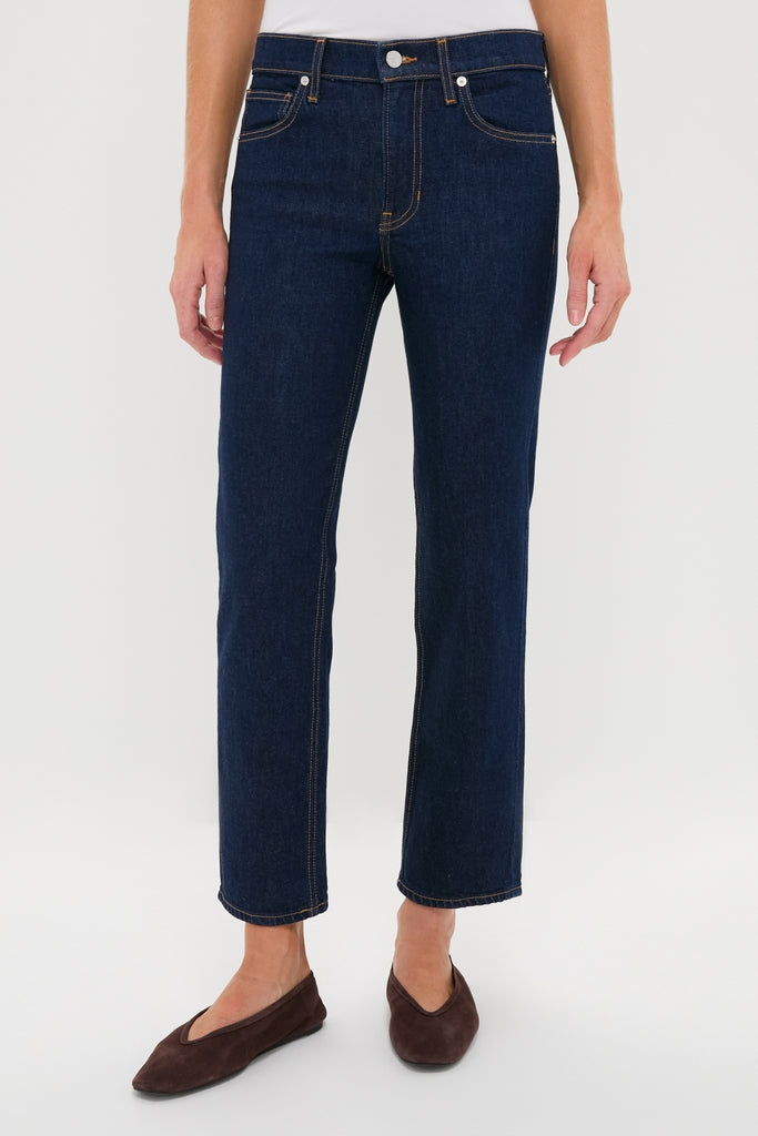 Indigo Rinse Leah Mid Rise Straight Leg jeans showcase classic five-pocket styling, effortless contrast stitching, and a high-end look, paired with dark brown flats for fun, stylish appeal.