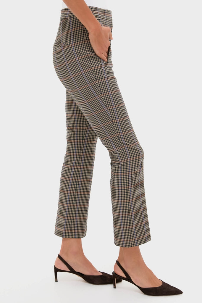 Model wears Russet Multi Arte Pant, a classic high-rise, slim-fit trouser with a slightly flared hem, embodying effortless style and high-end charm with fun plaid pattern.