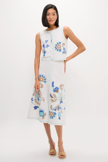 Model wearing the classic Folk Flower Embroidered Luna Top with matching A-line skirt, showcasing effortless, high-end style with fun floral embroidery and scalloped trim.