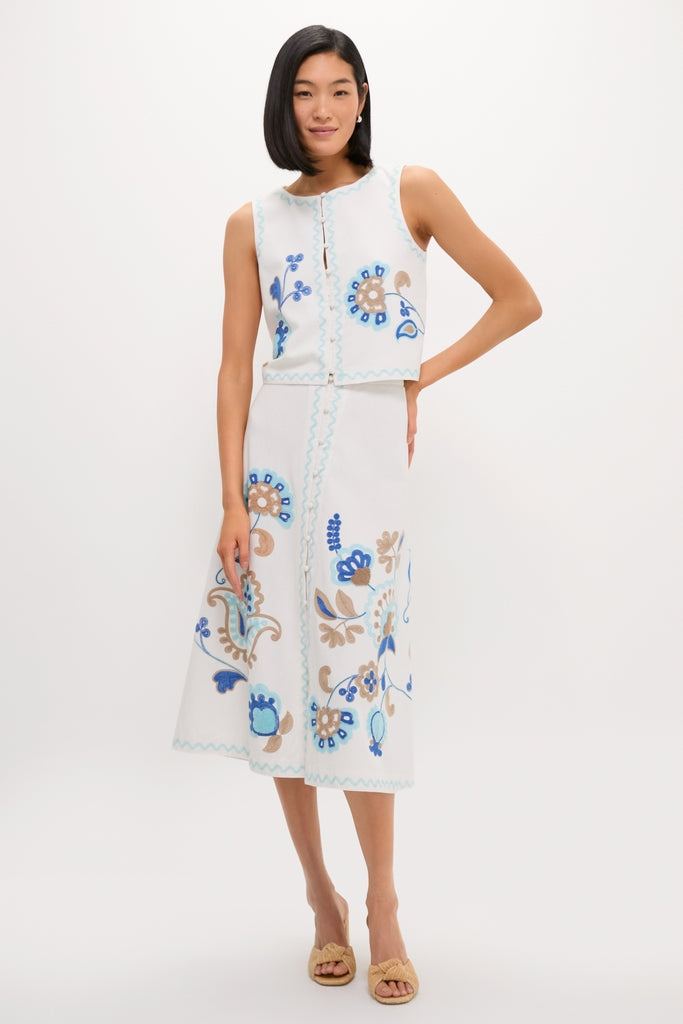 Model wearing the classic Folk Flower Embroidered Luna Top with matching A-line skirt, showcasing effortless, high-end style with fun floral embroidery and scalloped trim.