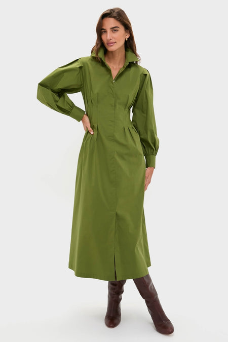 Model wearing the Fern Corinne Dress, a classic, shirt-style maxi with puffed shoulders and a waist-defining cut, exuding effortless elegance and fun with high-end appeal.
