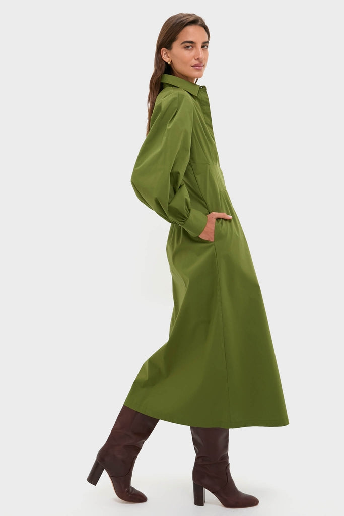 Model wearing the classic Fern Corinne Dress, an ankle-length shirt-dress with puffed sleeves and side pockets, paired with high-end leather boots for an effortless, fun look.