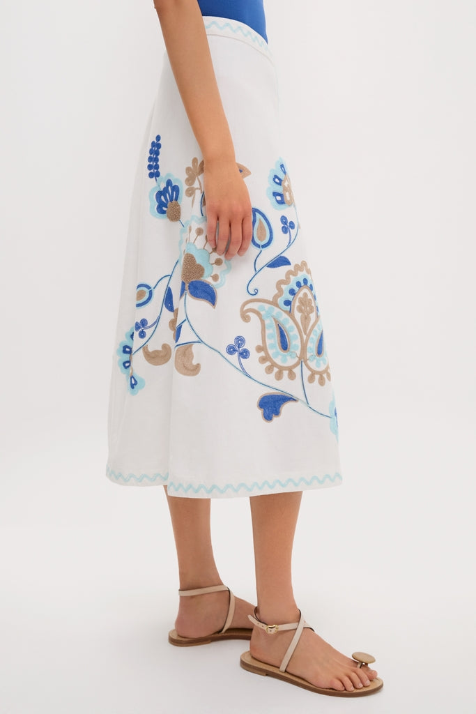 Folk Flower Embroidered Sadie Skirt: A classic, high-end, calf-length skirt with blue and tan floral embroidery, offering an effortless and fun style for any occasion.