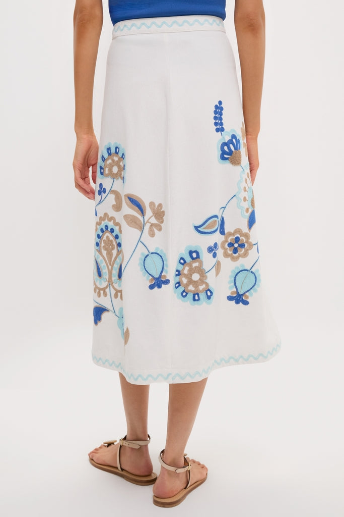 Folk Flower Embroidered Sadie Skirt, a classic and effortless piece in 100% cotton with blue floral embroidery, perfect for a fun, high-end look.