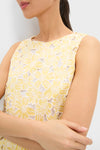 Woman wearing the Pale Yellow Flower Vera Top, featuring a classic and effortless floral lace pattern, reflecting Tuckernuck's fun and high-end style.