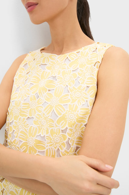 Woman wearing the Pale Yellow Flower Vera Top, featuring a classic and effortless floral lace pattern, reflecting Tuckernuck's fun and high-end style.