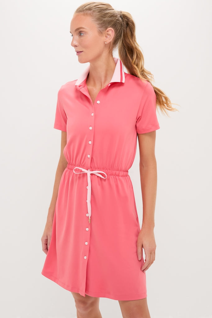 Model in classic Coral Short Sleeve Performance Jersey Alcott Golf Dress with drawstring waist and tipped collar, embodying effortless style and high-end functionality for fun, versatile wear.