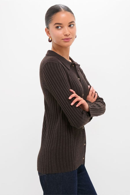 Young woman models the Chocolate Fine Rib Knit Button Down Myers Polo, a classic and effortless dark brown ribbed cardigan, paired with dark jeans, embodying high-end, fun style.