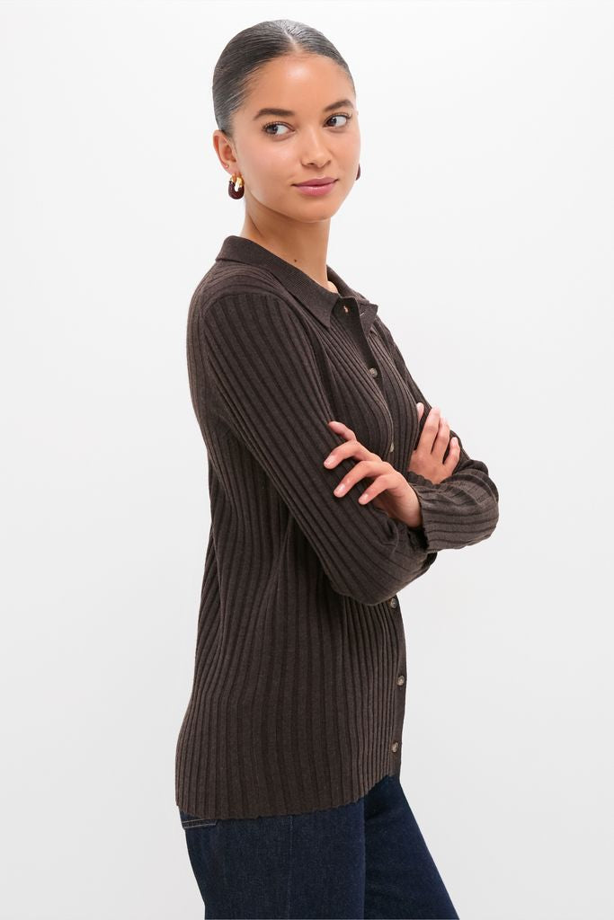Young woman models the Chocolate Fine Rib Knit Button Down Myers Polo, a classic and effortless dark brown ribbed cardigan, paired with dark jeans, embodying high-end, fun style.
