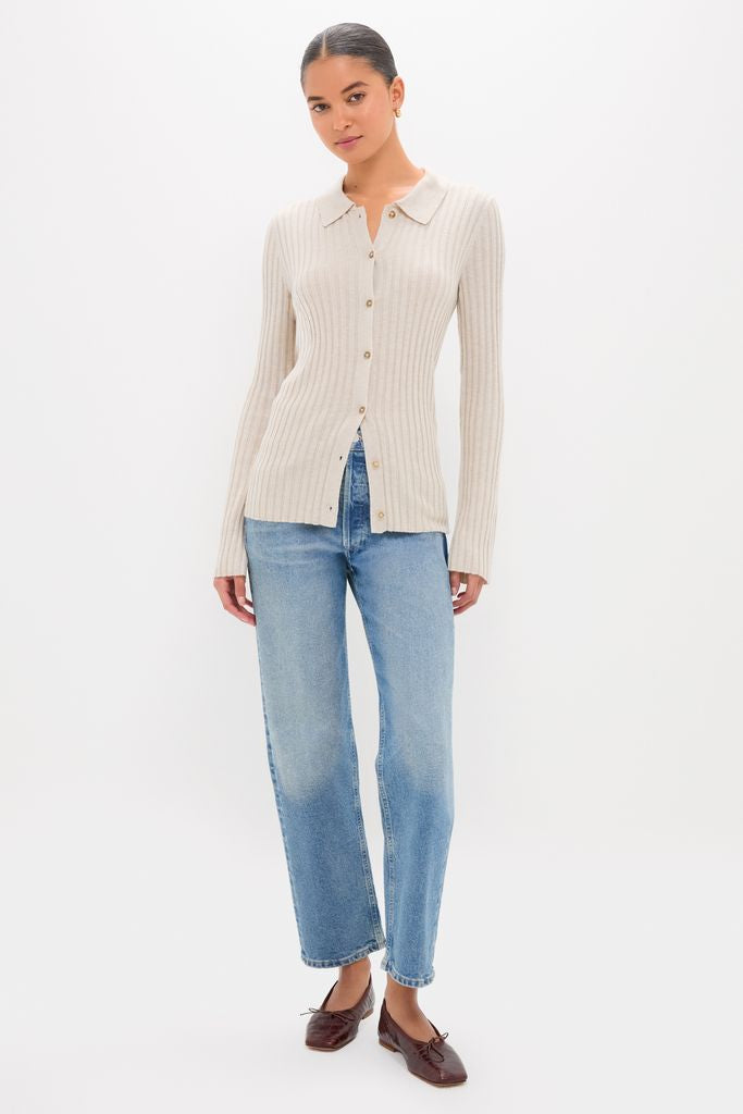 Model wearing the classic Sandstone Fine Rib Knit Button Down Myers Polo, paired with straight-leg jeans and ballet flats for an effortless, high-end, and fun look.