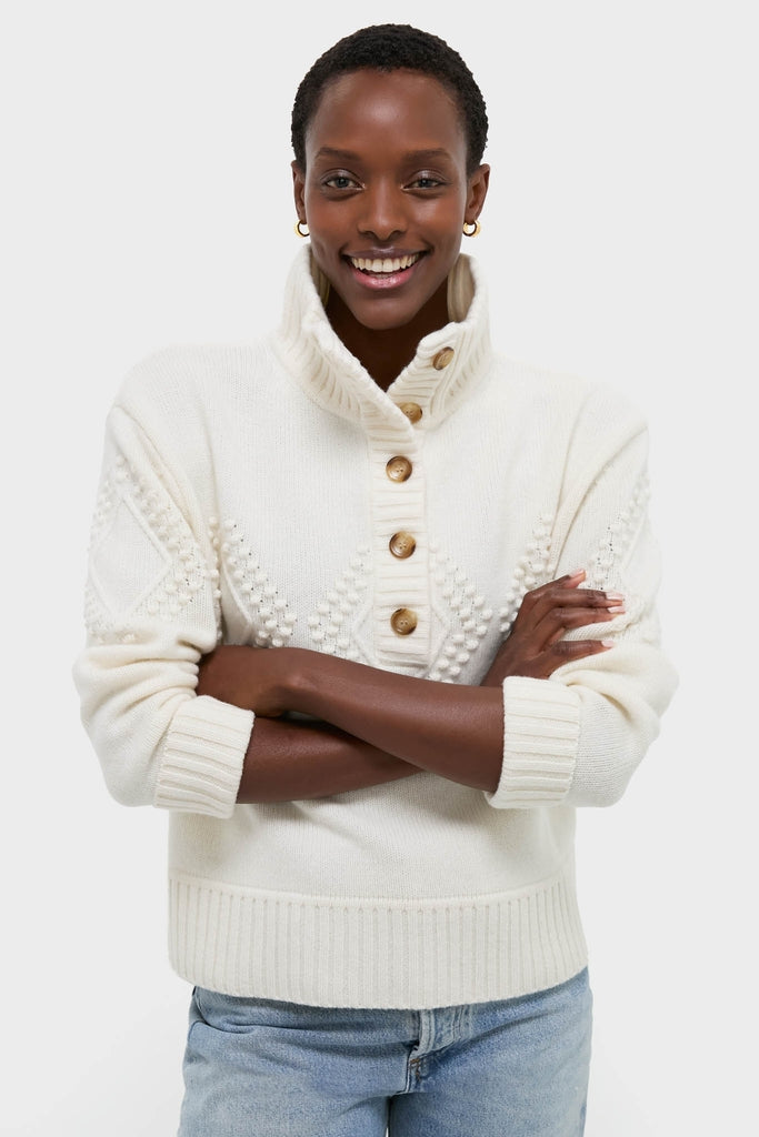 Ivory Henry Button-Up Sweater showcases classic, effortless style with textured detailing and ribbed finishes, embodying high-end fun, perfect for pairing with denim for a chic look.
