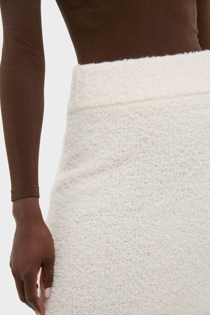 Effortlessly chic, the Ivory Boucle Lillia Sweater Skirt features a classic high-waisted design and textured knit, embodying Tuckernuck's fun, high-end style for versatile elegance.