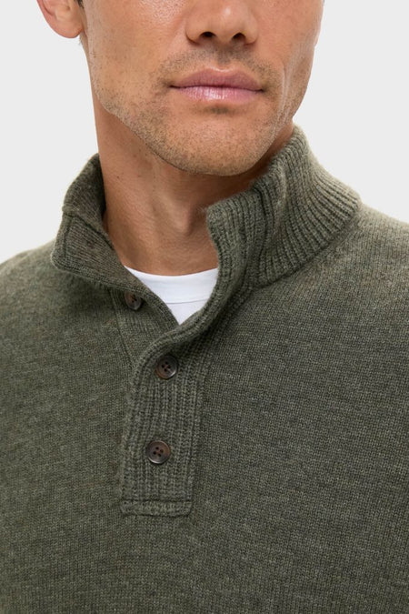 Man wearing the classic Olive Green Cashmere Wool Button-Up with a ribbed high collar and button placket, offering an effortless and high-end winter look.