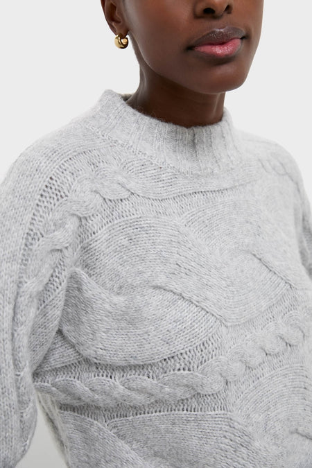 Gray Cableknit Gladwyn Sweater with classic braided cables, mock neck, and ribbed details. The chic, high-end design offers an effortless, fun style.