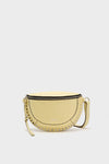 Butter Skano Fannypack: A classic, high-end crossbody bag featuring a half-moon shape with a top zipper, adjustable strap, and decorative metal studs for an effortless, fun style.