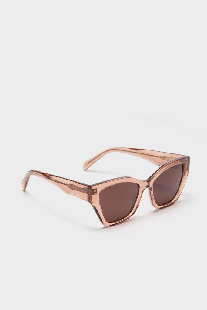 Cafe Ole Evie Polarized Sunglasses with classic cat-eye design, rose-toned acetate frames, and brown-tinted lenses offer an effortless, fun, high-end style.