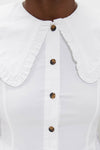 Classic Bright White Stretch Cotton Peter Pan Collar Shirt with a ruffled trim and tortoiseshell-style buttons, offering an effortless, high-end look for fun, confident style.