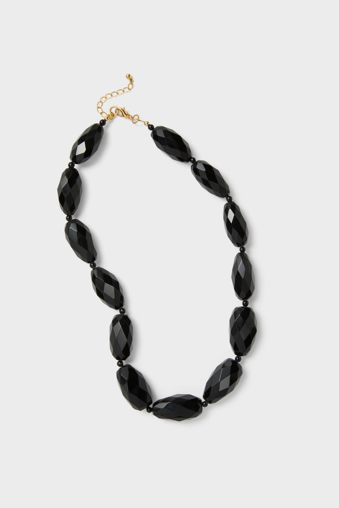 Onyx Wrenlee Necklace: A classic, high-end piece with faceted black beads and adjustable gold-tone clasp, offering an effortless, fun style for any occasion.