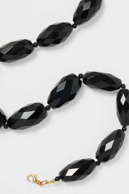 Onyx Wrenlee Necklace, a classic and high-end piece, features faceted black barrel beads with round spacers and a gold-tone lobster-claw clasp for an effortless, fun style.