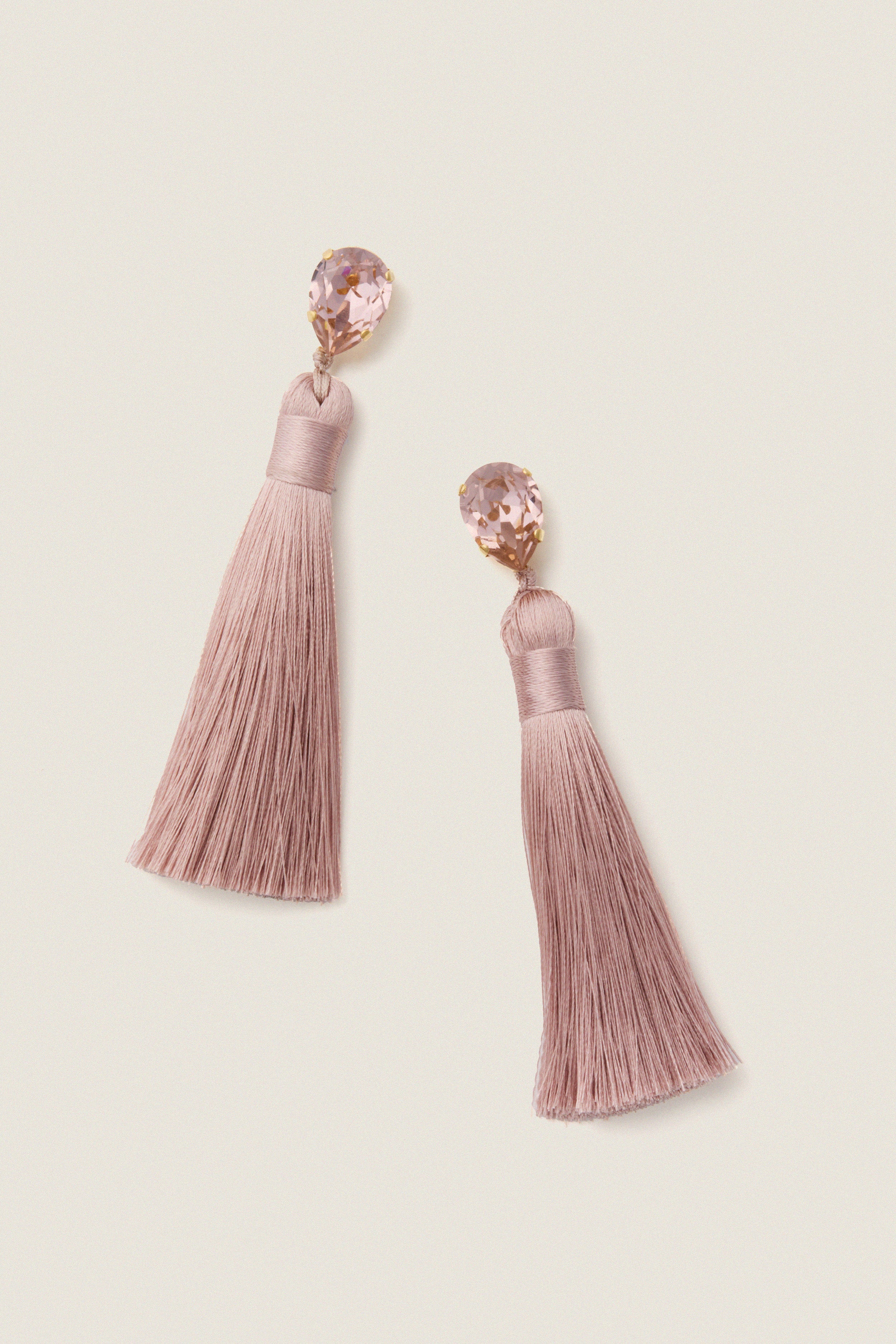 Vintage Rose Francine Earrings with pear-shaped crystals and silky tassels exude classic, effortless glam, perfect for a fun, high-end occasion.