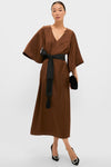 Effortless elegance in the Chocolate Brown Satin Emiliana Maxi Dress, featuring a classic V-neck, kimono sleeves, and a high-end tasseled sash. Perfect with heels and clutch.