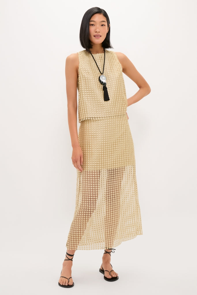 Model wearing the Gold Metallic Star Lace Eve Skirt and Keating Top, a classic, effortless ensemble with fun, airy texture, perfect for high-end beach or resort settings.