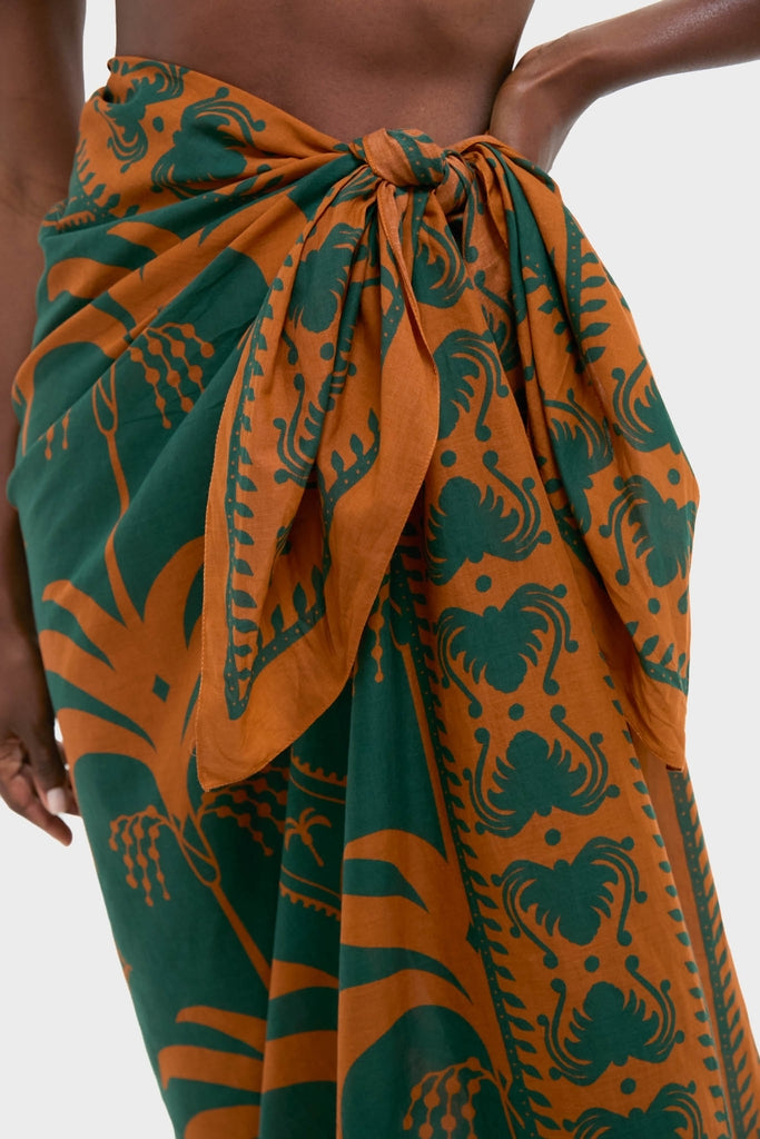 Close-up of a classic Rust and Dark Green Dance of Pareo, an effortlessly tied wrap skirt, showcasing a fun and high-end design perfect for any occasion.