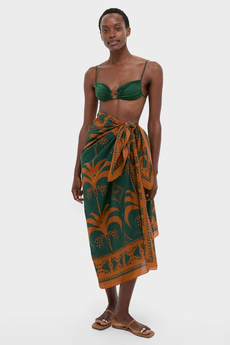 Effortlessly cool and classic, the Rust and Dark Green Dance of Pareo features a chic bikini top and wrap skirt, epitomizing high-end, fun fashion.