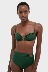 Woman models the classic Sumatra Green Tangle Up Bikini Top with an effortless beaded ring and ruched detail, embodying fun, high-end style.