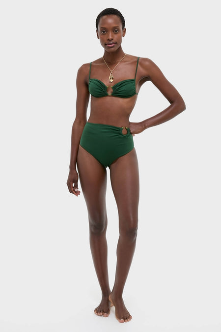 Model wearing the classic, Sumatra Green Tangle Up Bikini Top with beaded ring and ruched detailing, embodying effortless, high-end style for fun, confident beachwear.